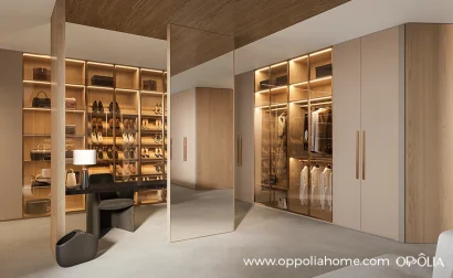 Big Walk in Closet with Beige and Light Wood Cabinets